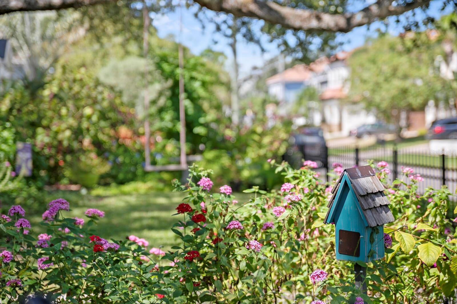 Bird houses and bird baths front and back. So many birds and butterflies. Stay a while.