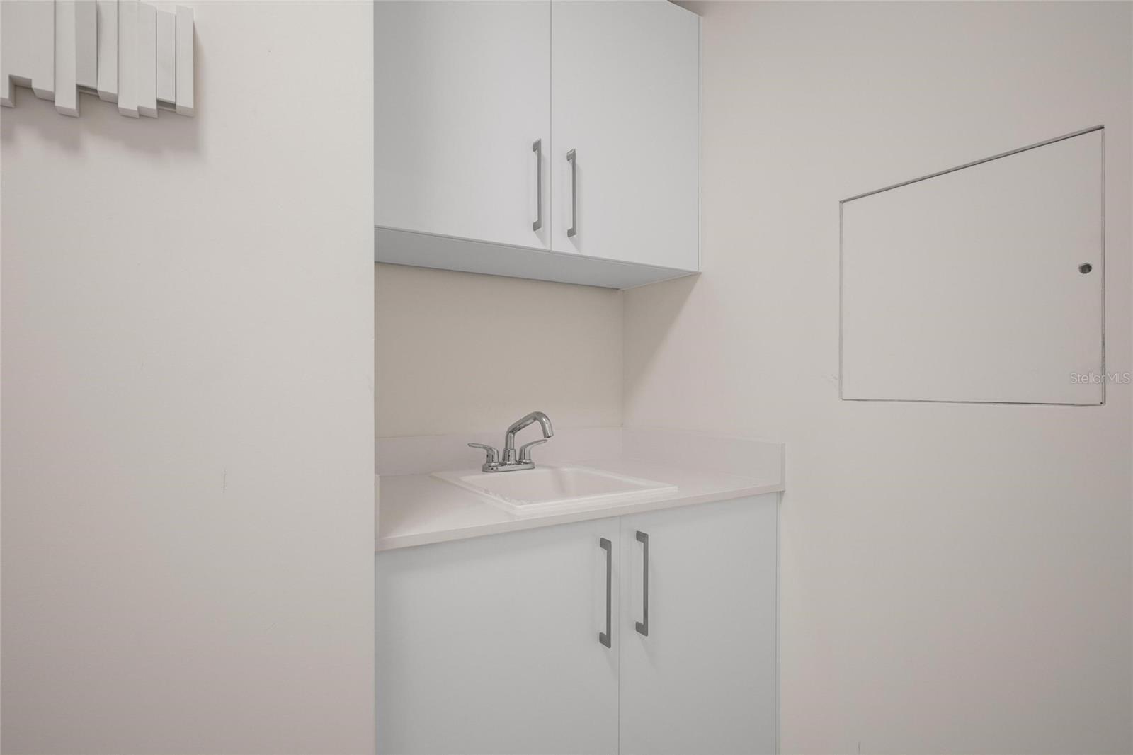 laundry room with wash sink