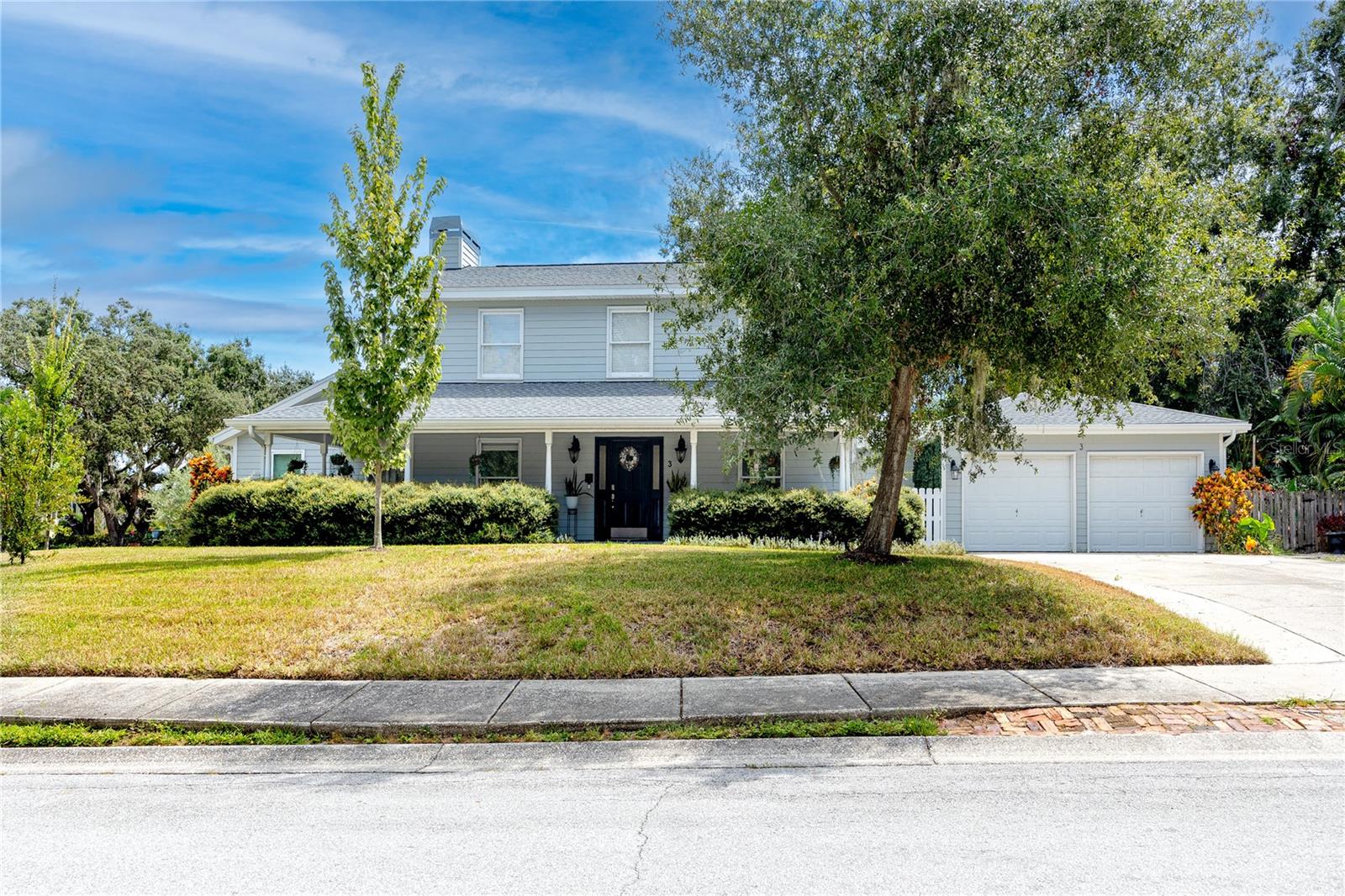 2 car air conditioned garage and large parking pad with space for up to 6 vehicles. Welcoming wrap around porch to enjoy those beautiful Florida evenings.
