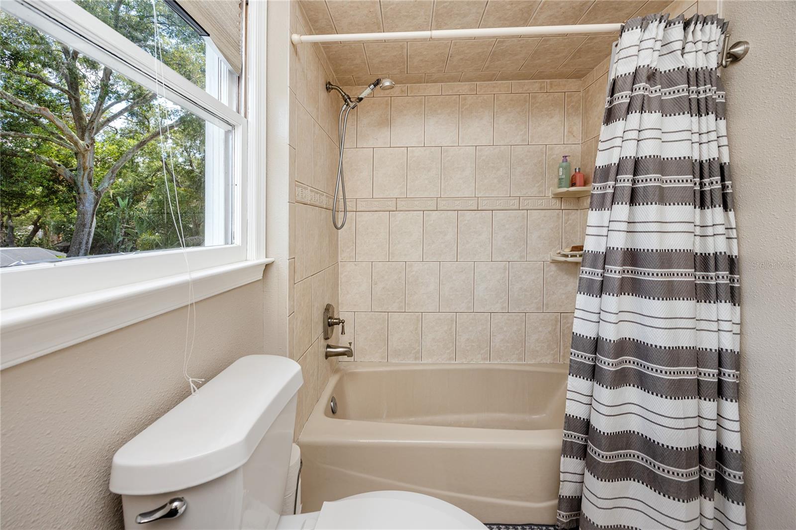 Primary ensuite bathroom with tub.