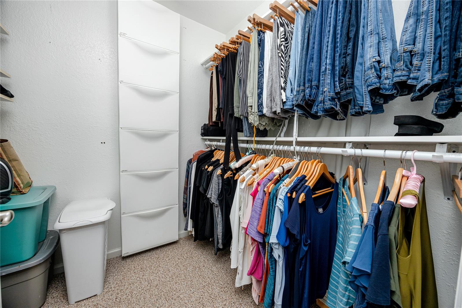 Primary bedroom walk in closet