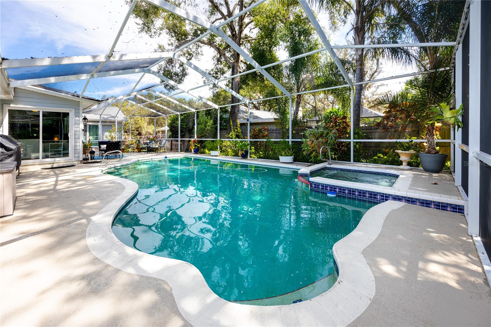 Large pool and spa with a screened in lanai adding to the livable space and a perfect place for those beautiful Florida days.
