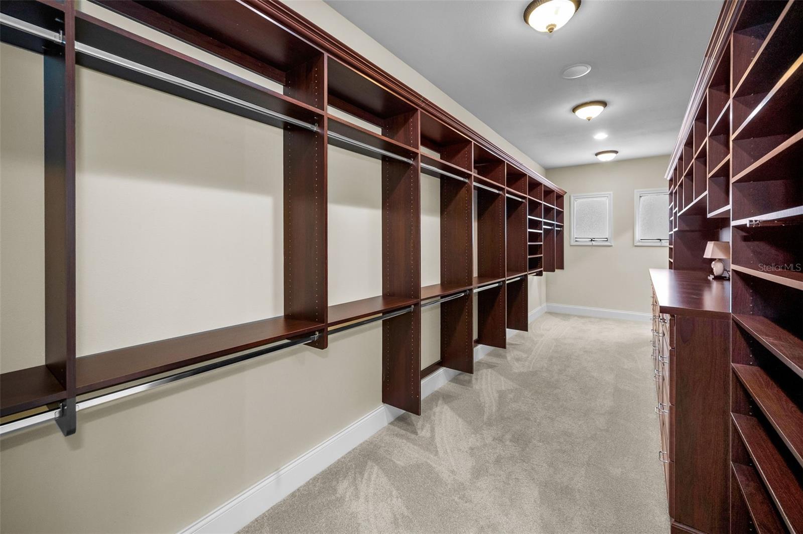 Primary bedroom walk in closet