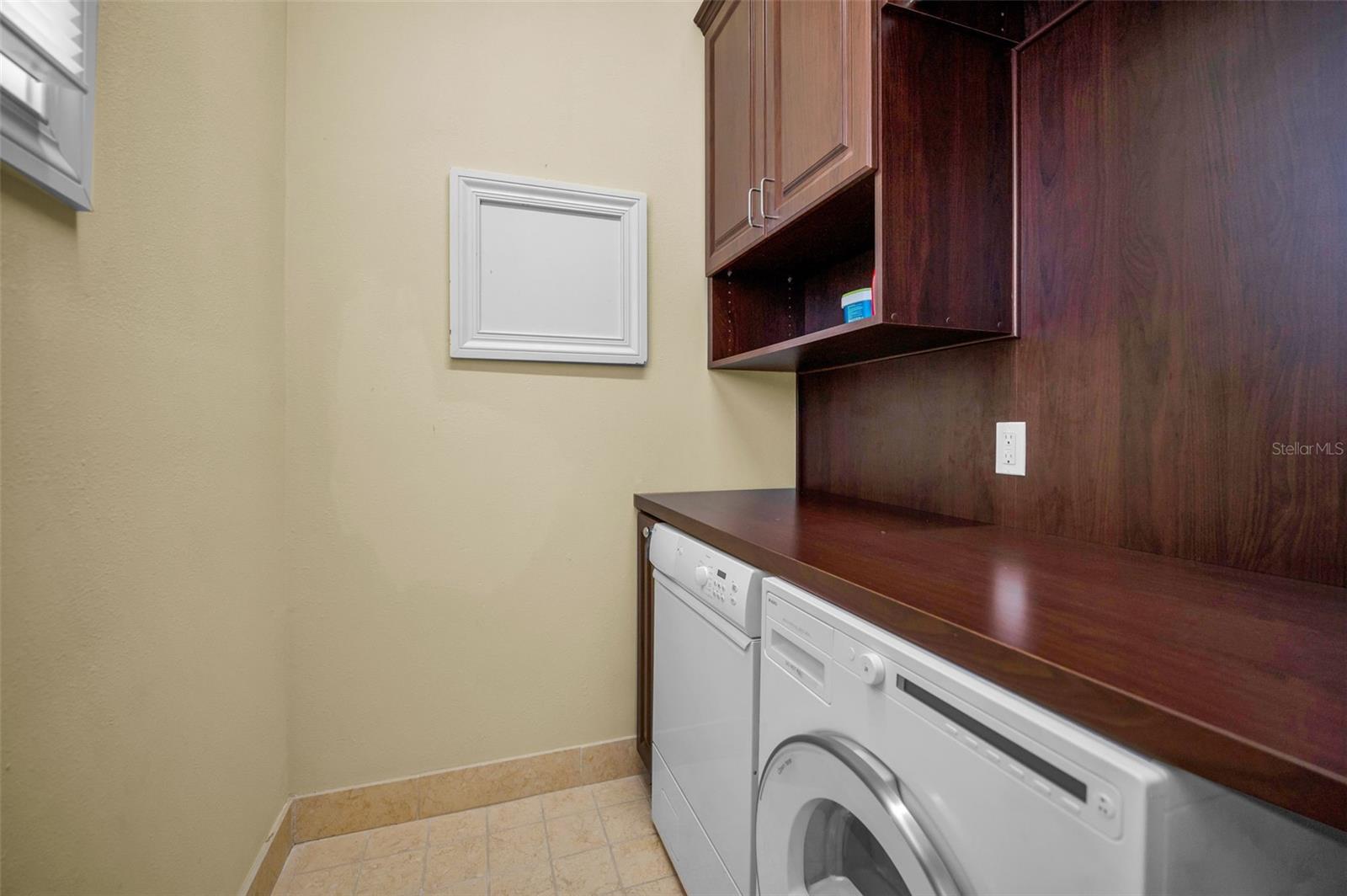 Washer & dryer in primary bedroom closet
