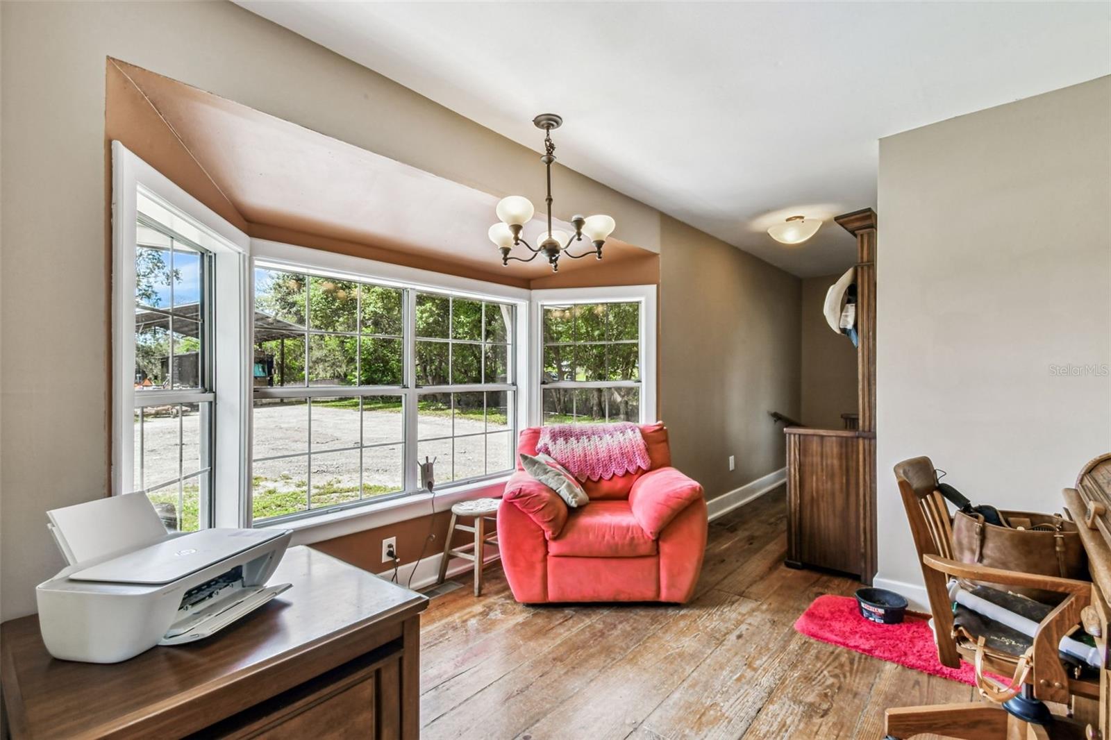 Dining sitting area looking out bay window towards backyard