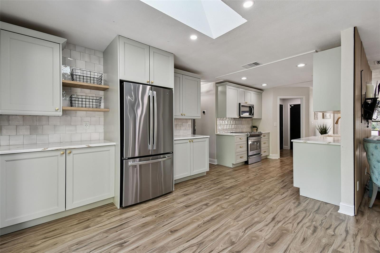 New Customized Designer Kitchen with Quartz Counter! Coffee Bar to the left, Lots of cabinet space.