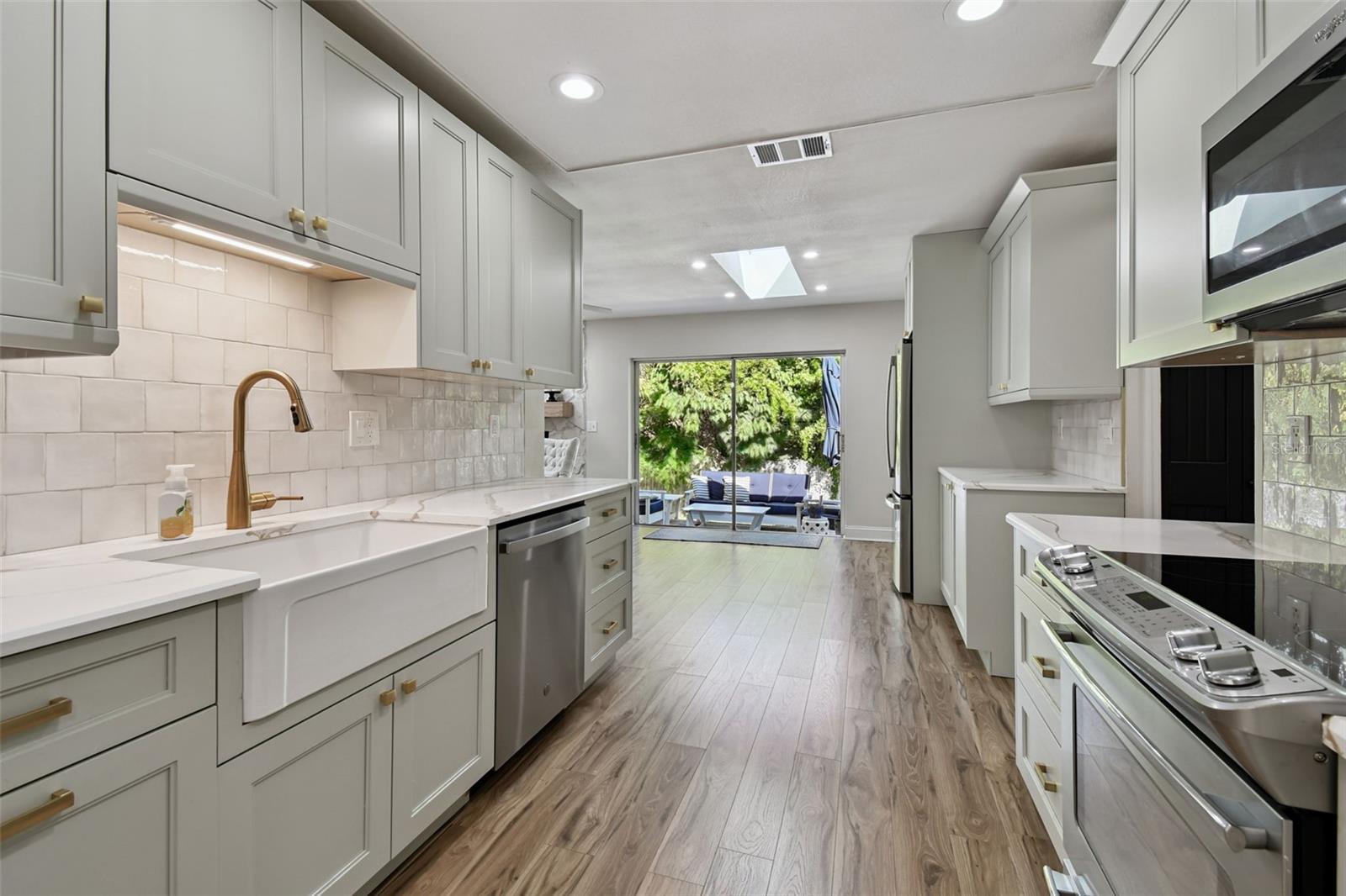 Kitchen looking to eating space that overlooks your private back yard.