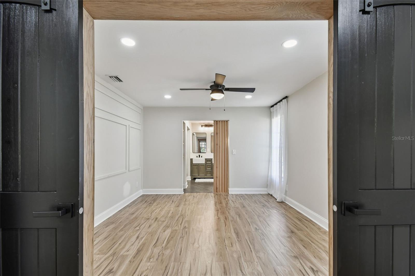 Primary Suite, Barn doors lead to suite from Bonus Room