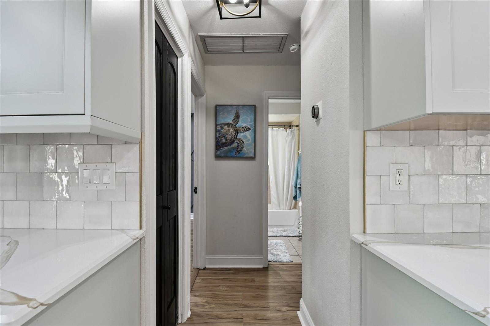 Hallway to secondary bedrooms and bath