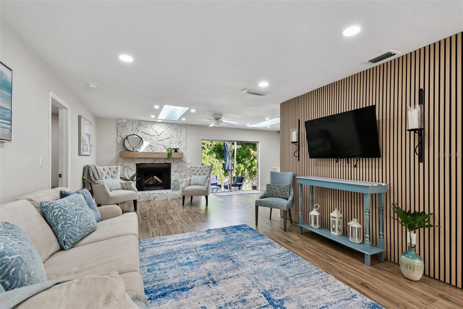 Family room with custom feature wall and fireplace!