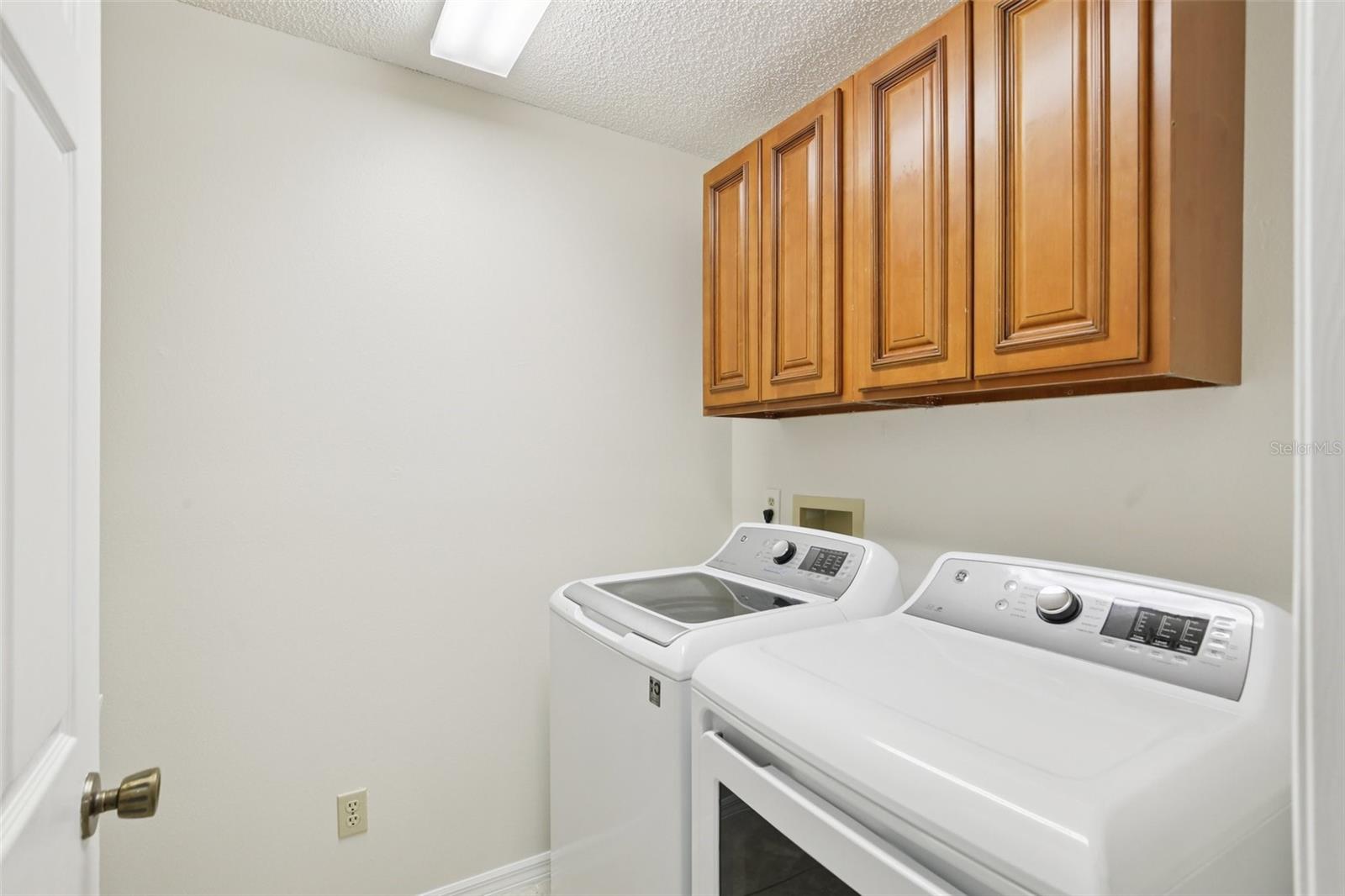 Laundry Room with above cabinets