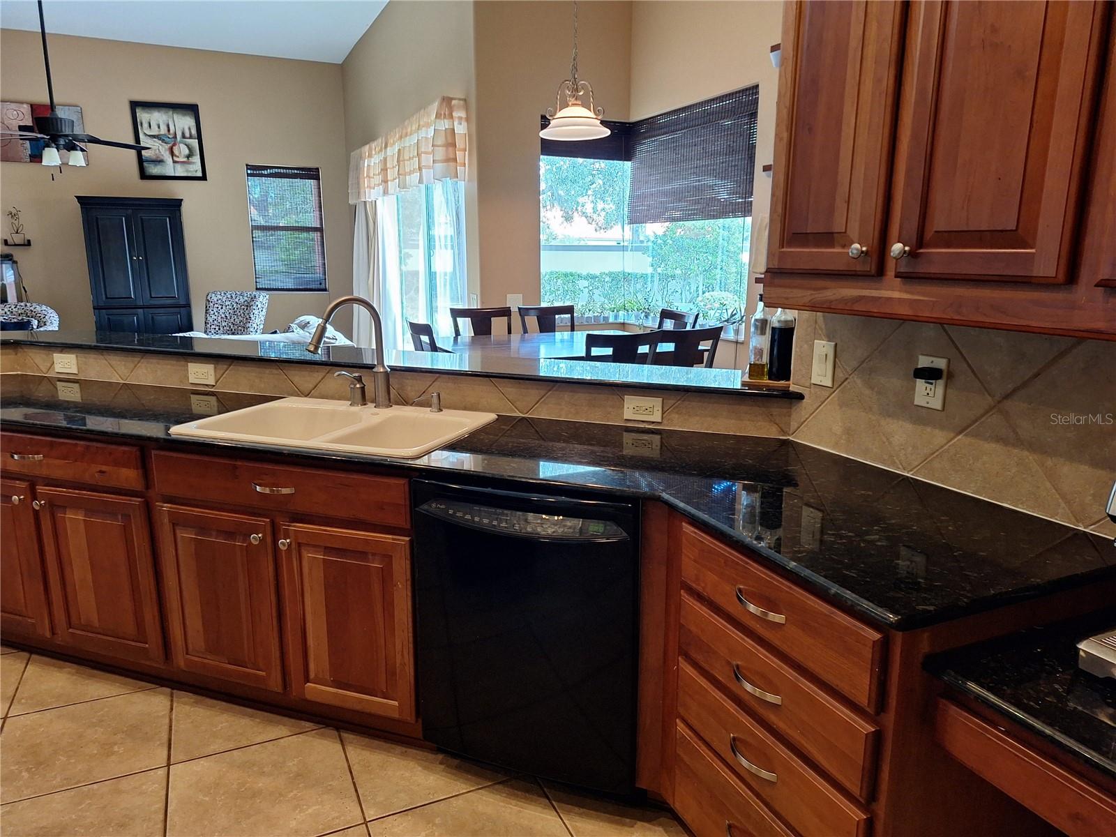 NIce Wood Cabinetry. Breakfast Room in distance