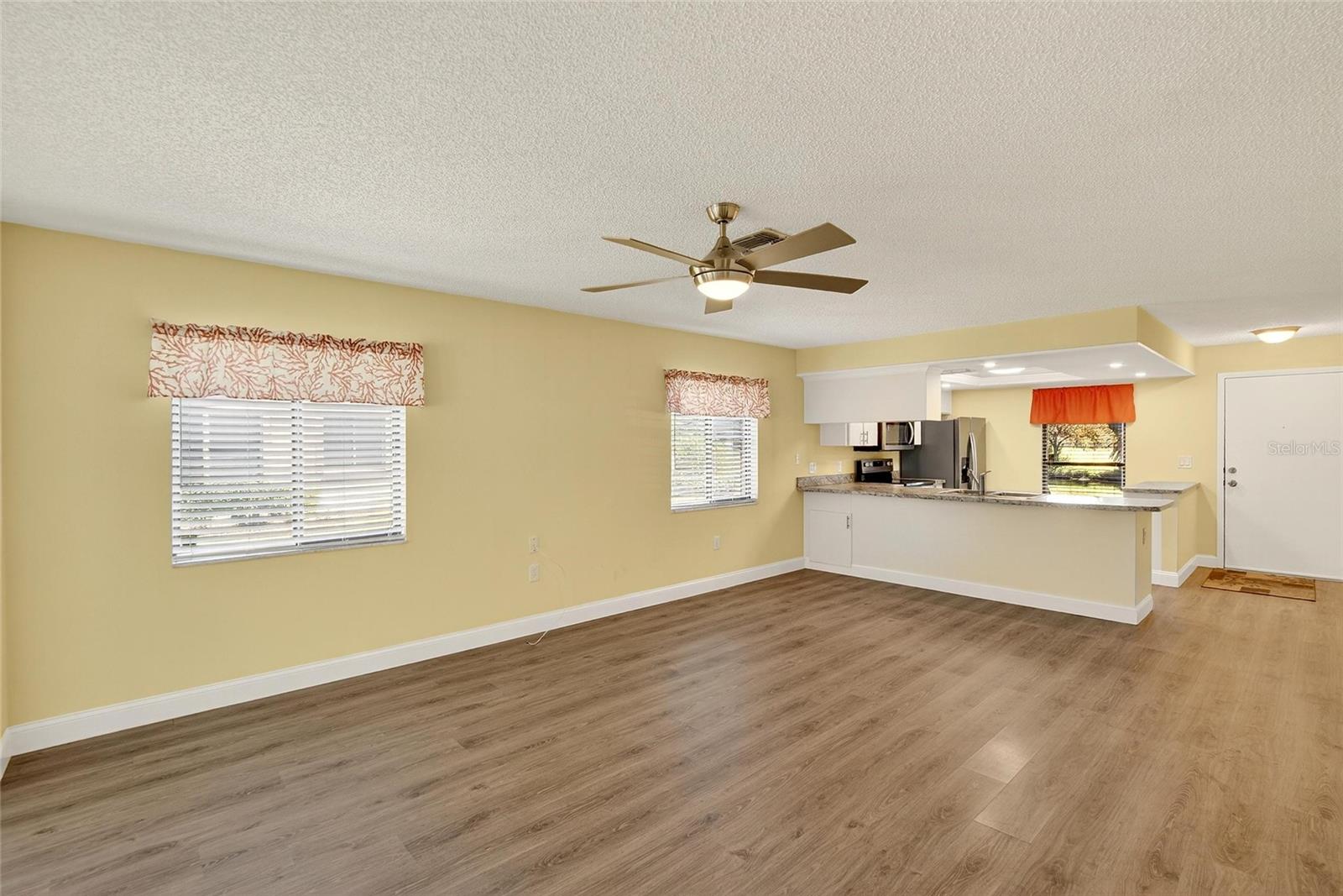 living /dining area with remote control fan/light