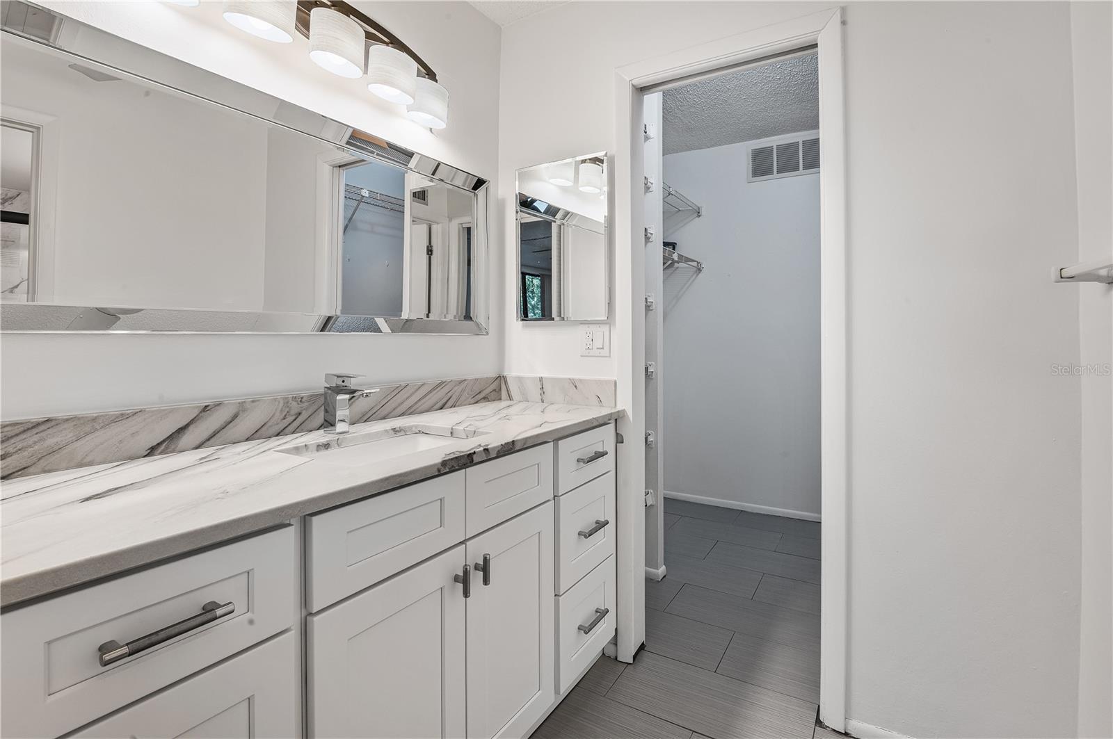 Primary bathroom and big walk-in closet