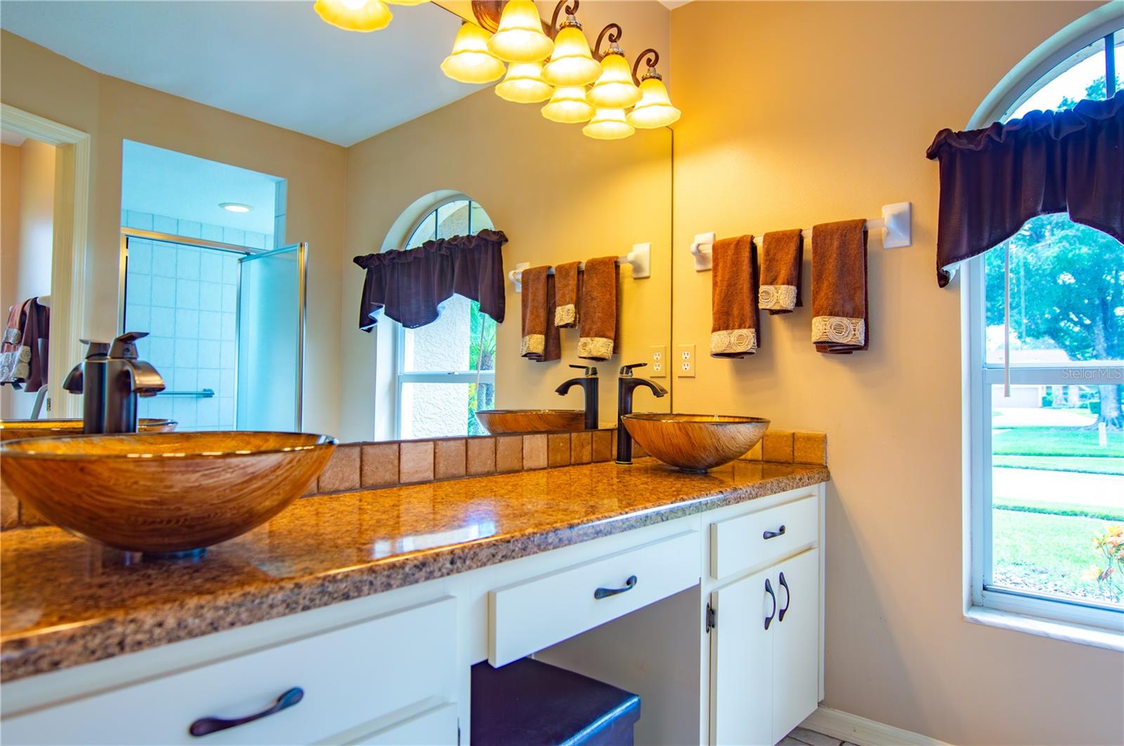 Double sinks and granite countertop in the Primary bathroom.