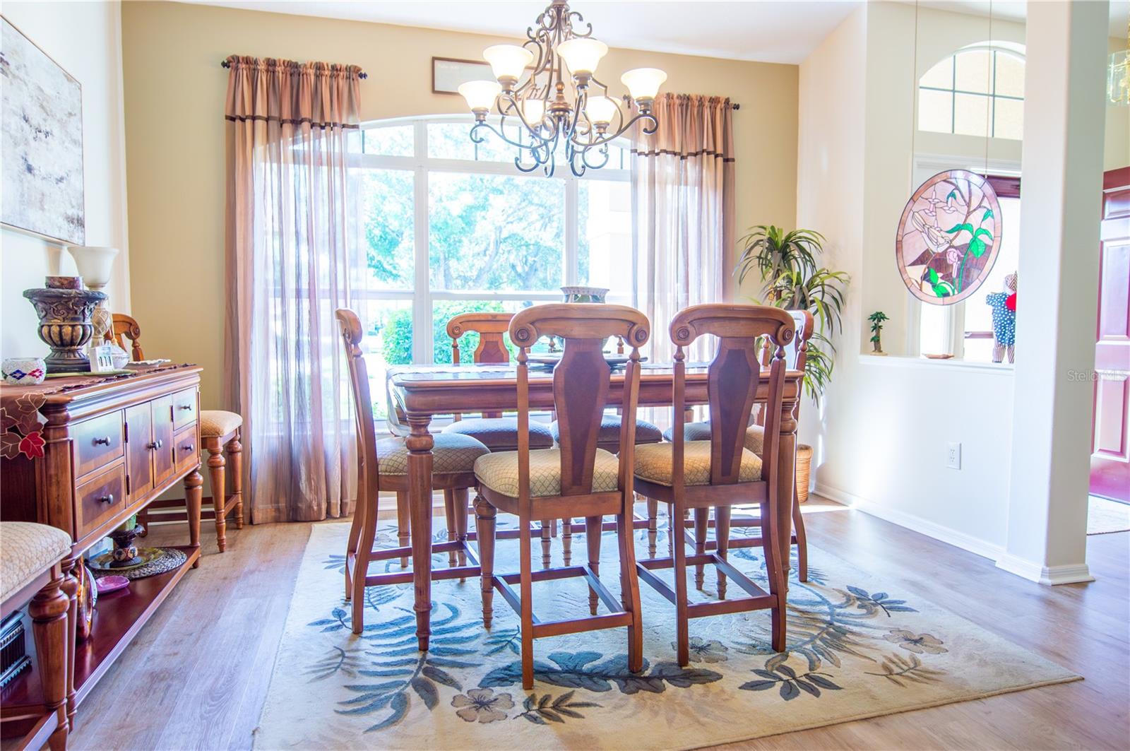 Elegant dining area with sunlight to brighten the room.