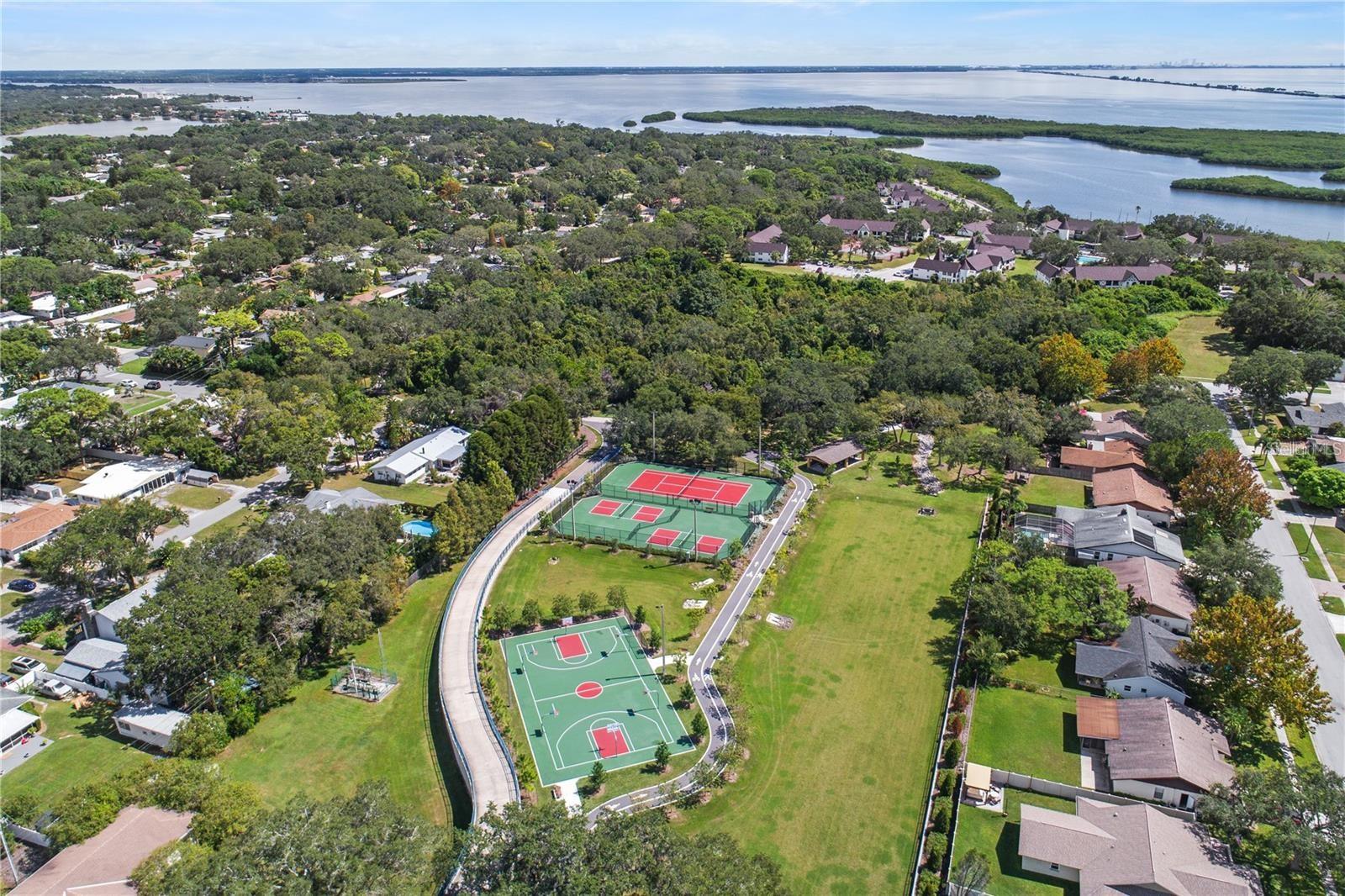 Community tennis courts and pickleball area.