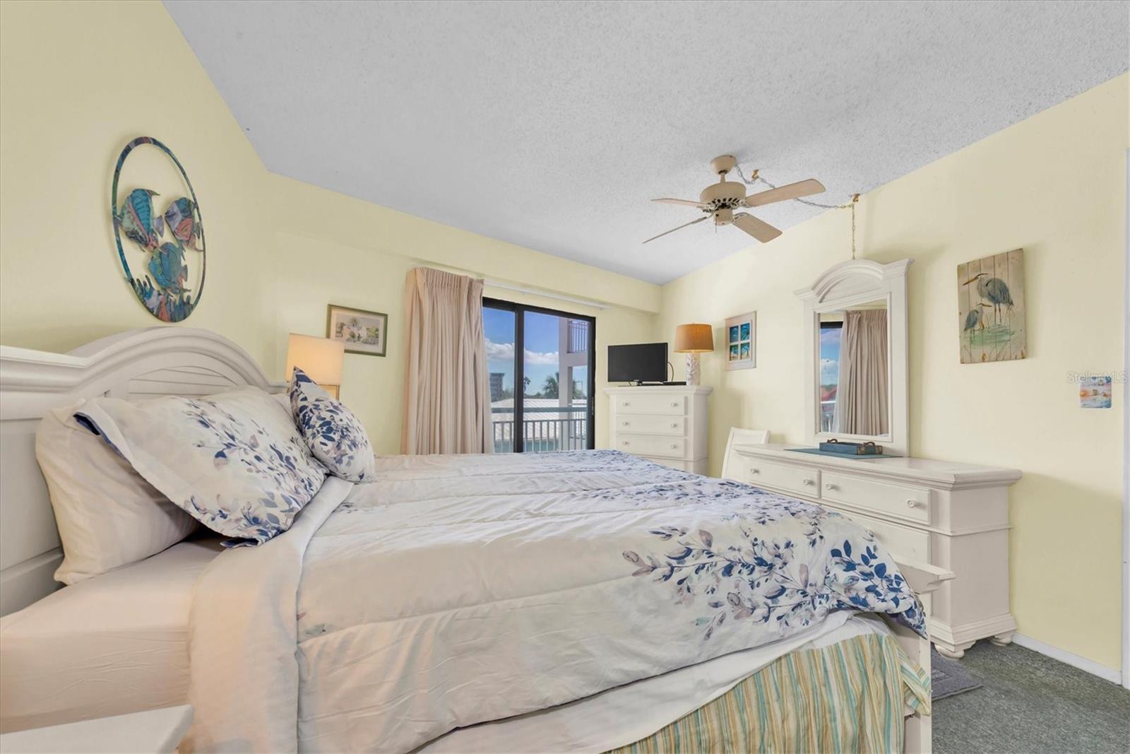 Primary bedroom with balcony access