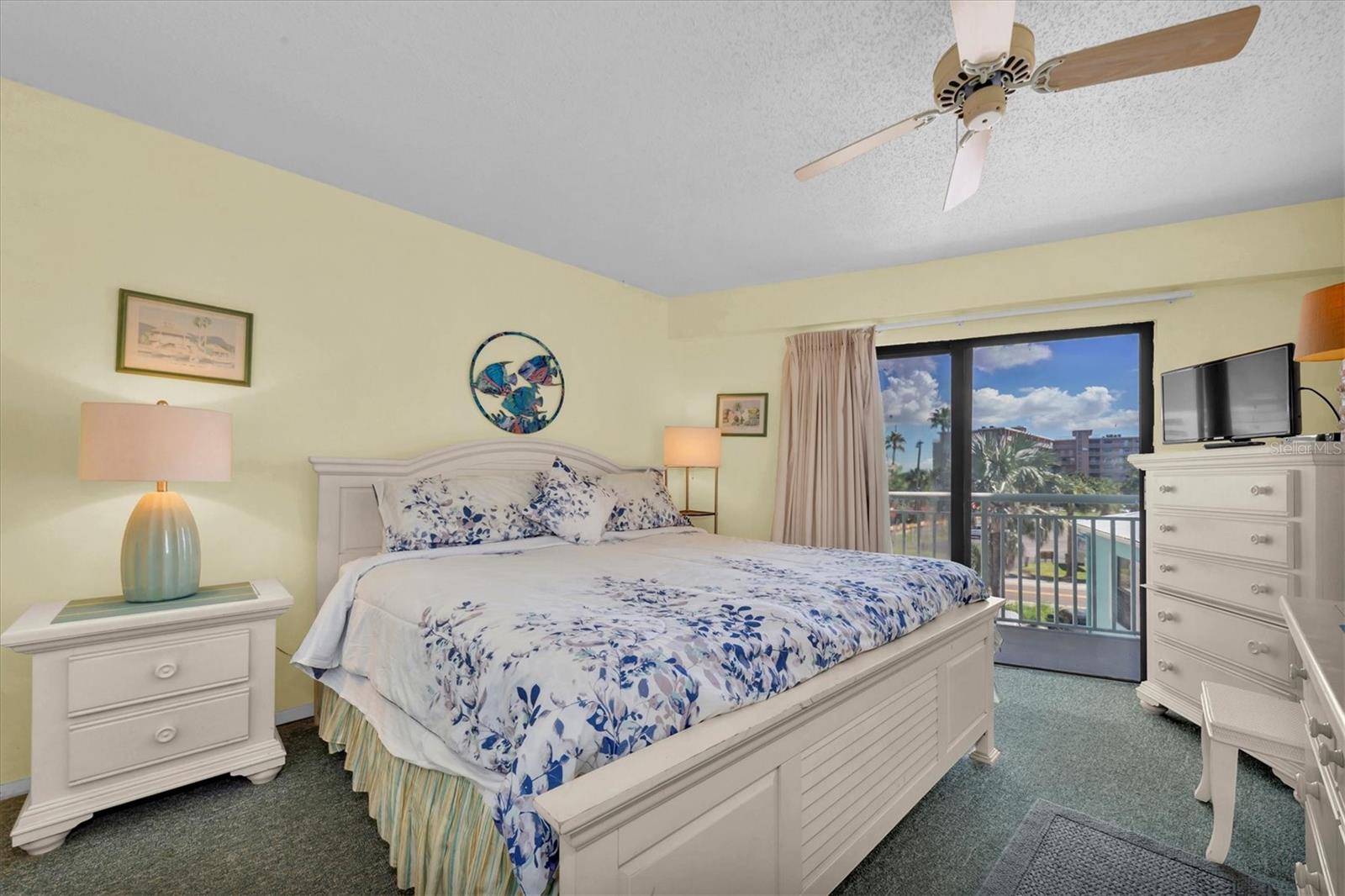 Primary bedroom with balcony access