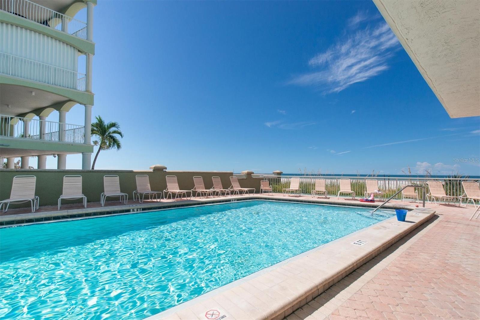 Refreshing pool  and hot tub with lots of seating