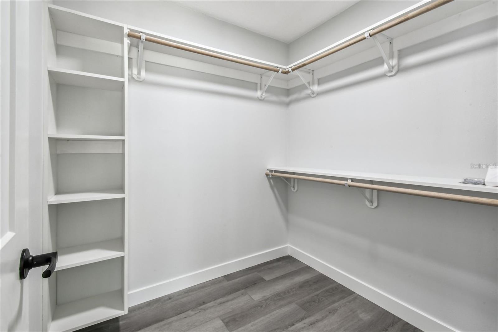 Walk in closet is such a nice feature with buit-ins and shelving