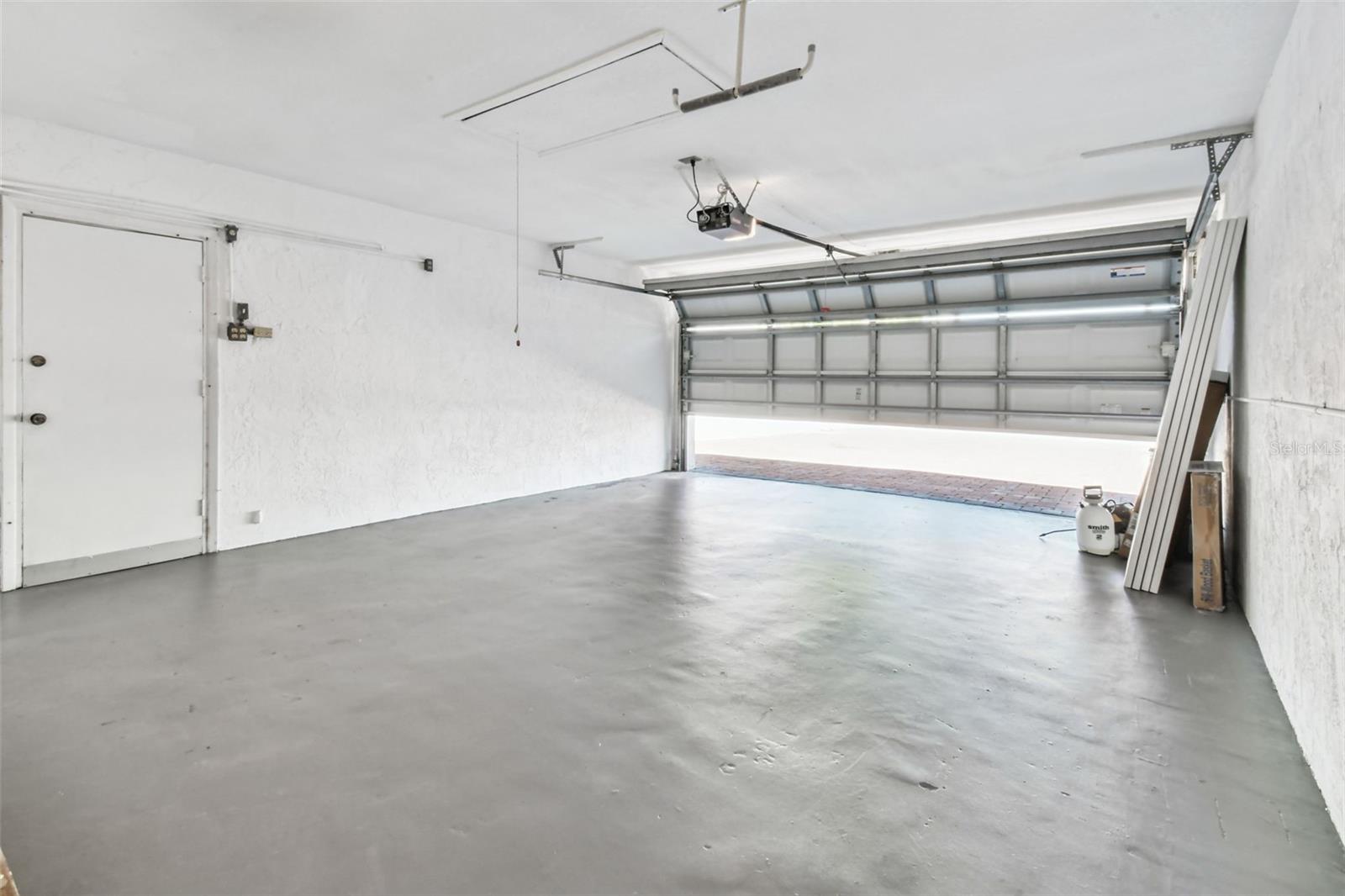 Roomy 2 car garage with recently painted floor