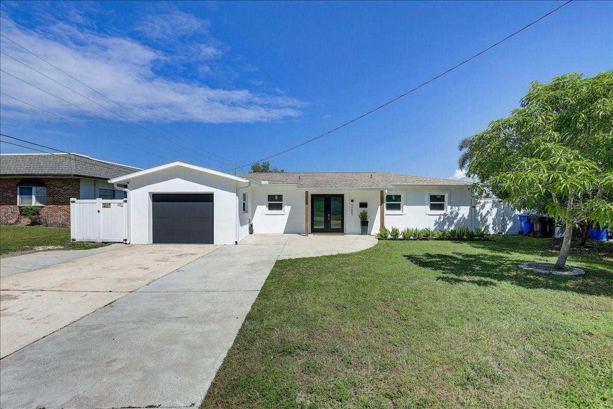 Front with oversized driveway