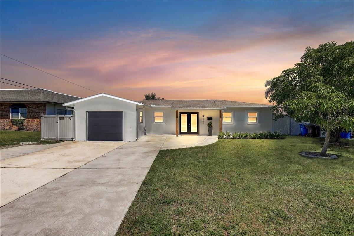 Front with oversized driveway