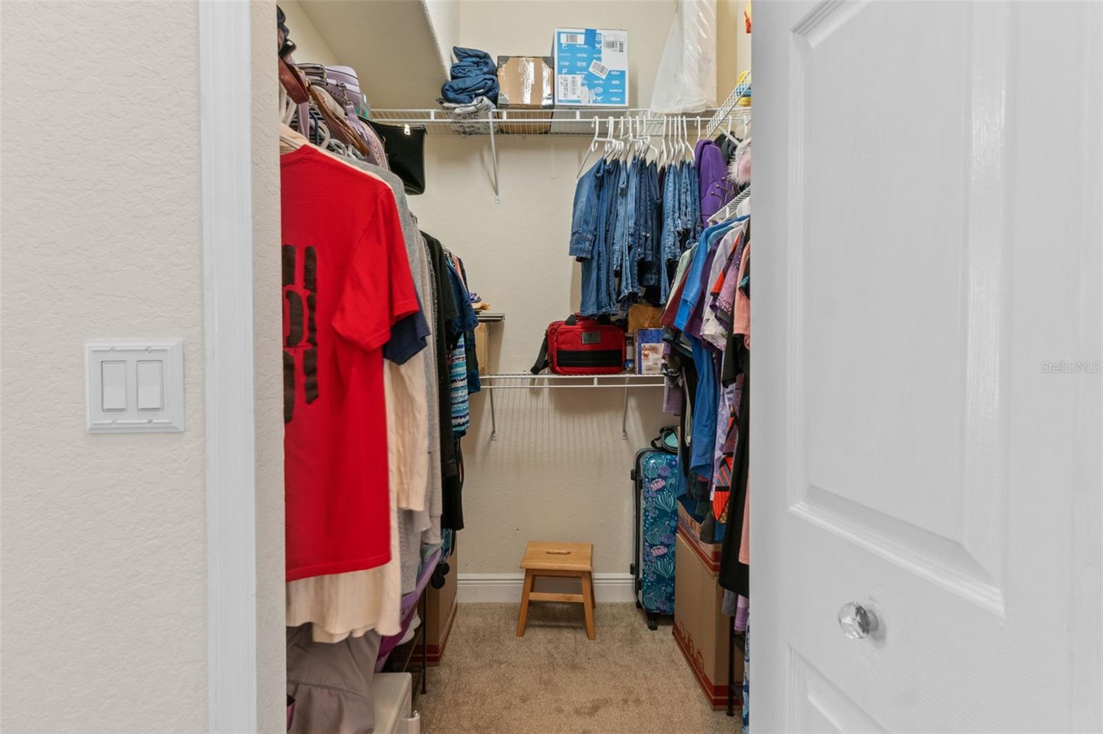 walk in closet in primary bedroom