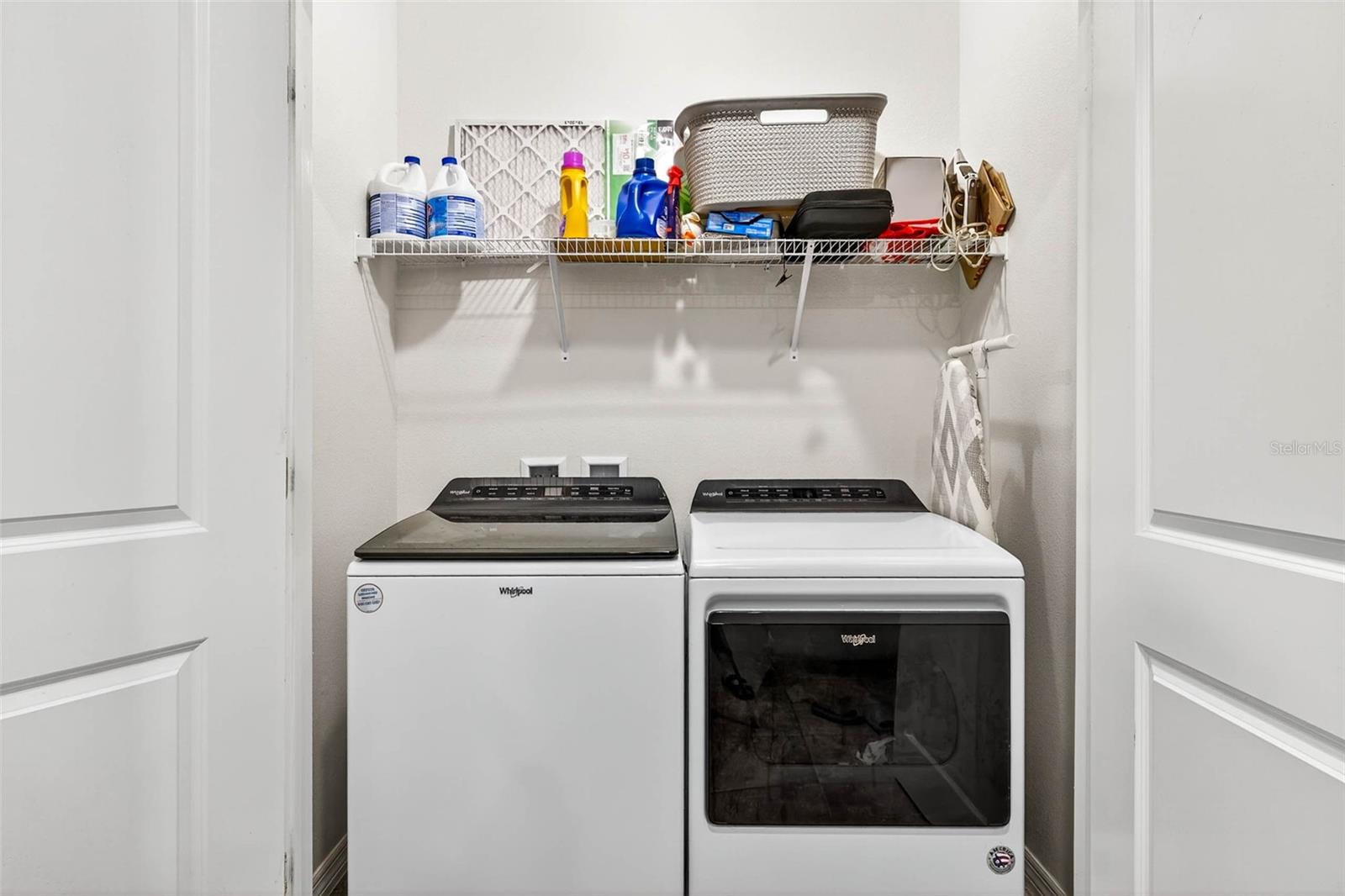 Landry closet with rack storage.