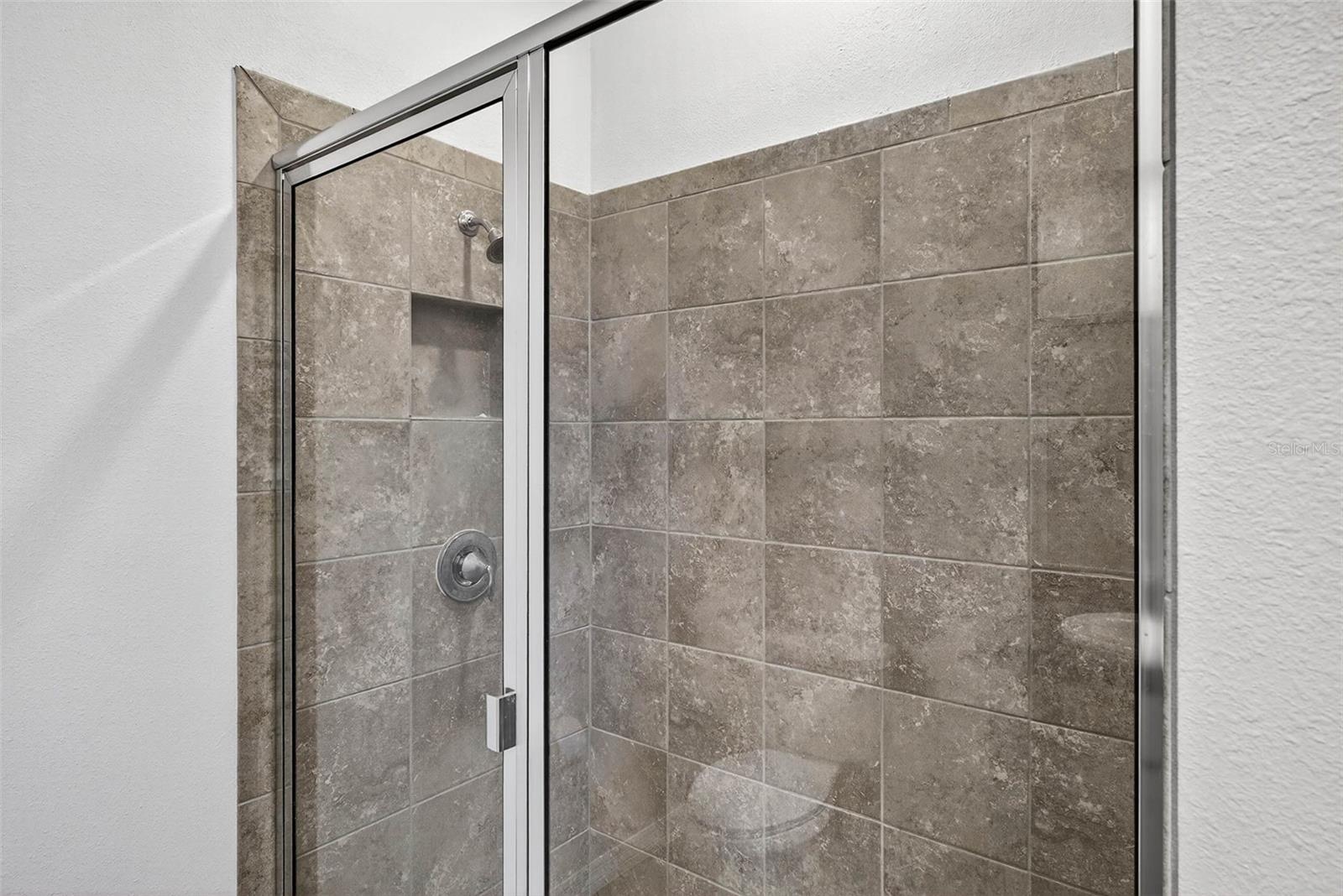 Walk in shower to the primary suite