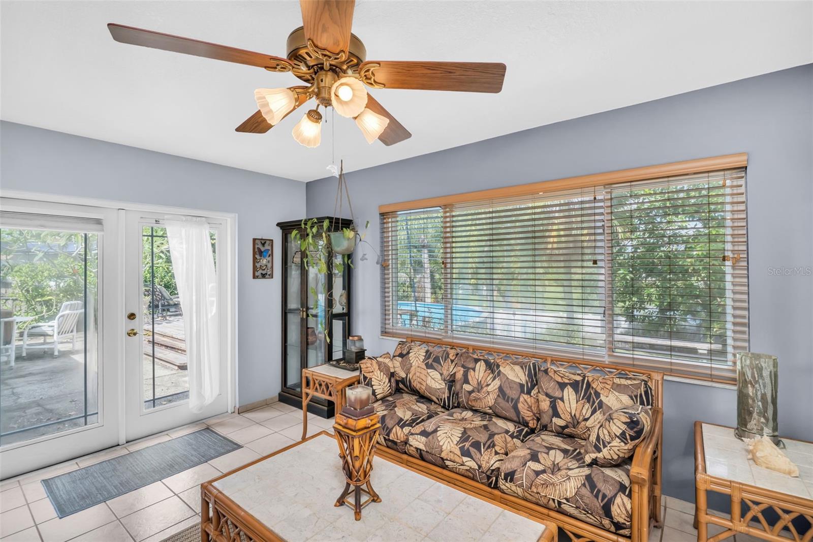 fam room with doors to pool and backyard