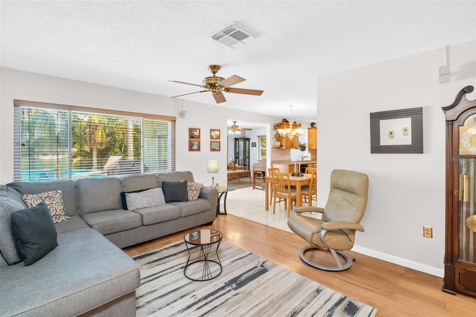 Living room with dining and fam rm views