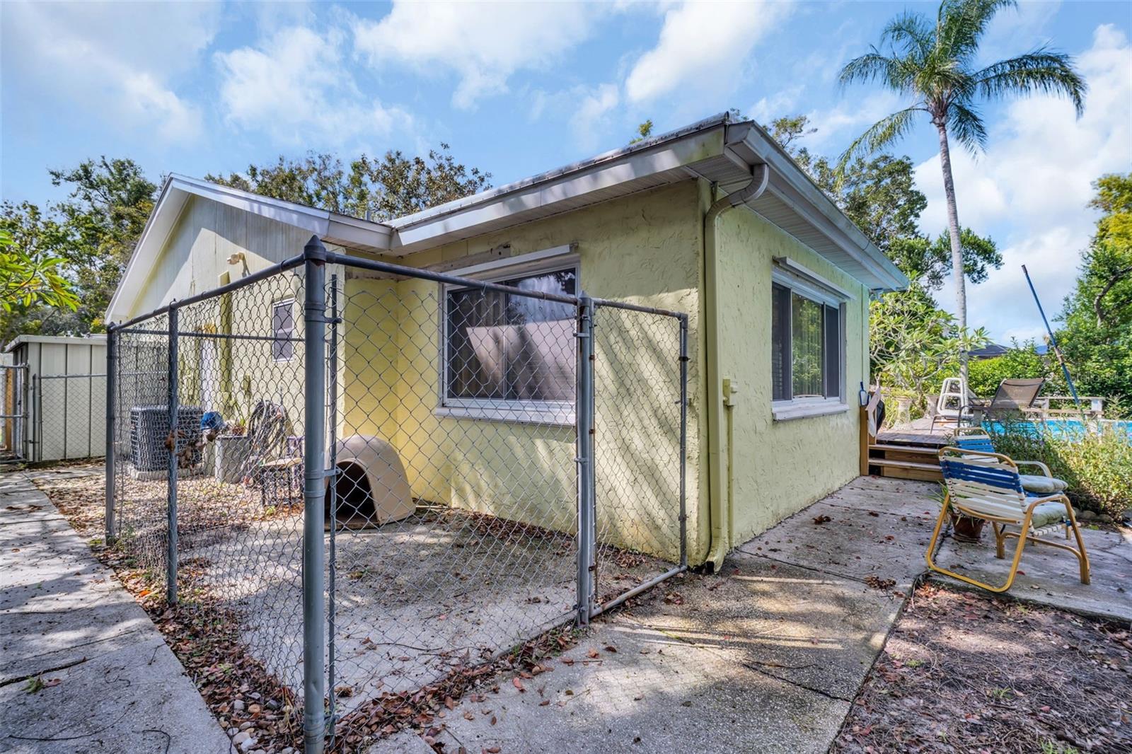 Pet run or storage area, shed behind