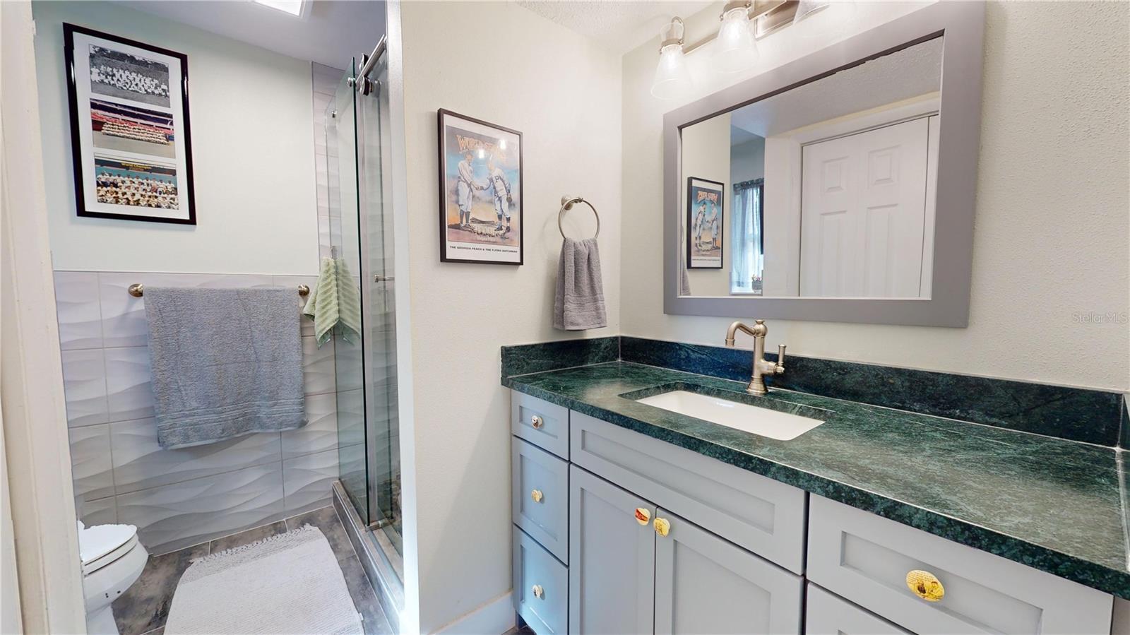 Primary ensuite bathroom with standing shower