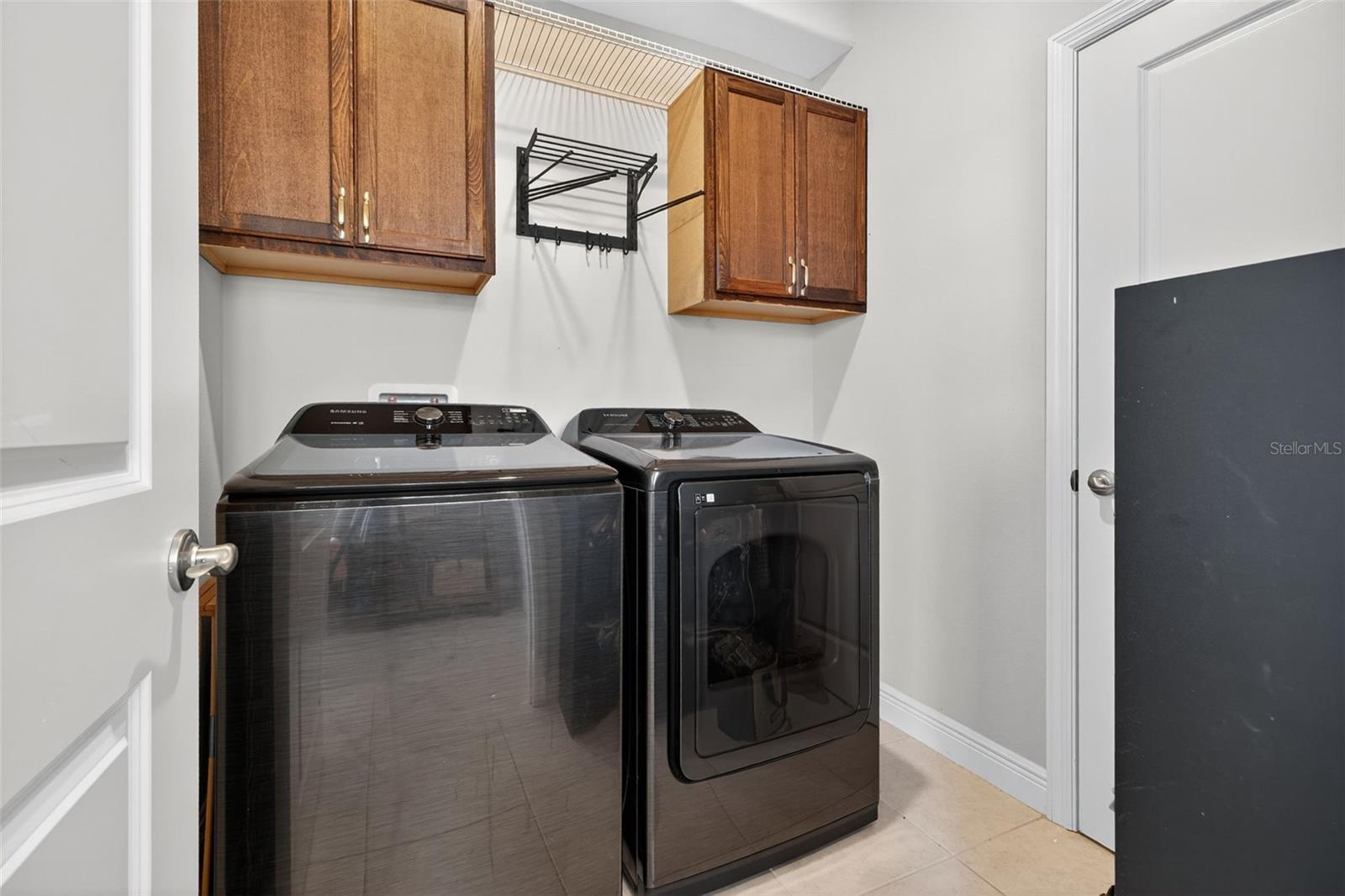 Spacious laundry room with gas dryer
