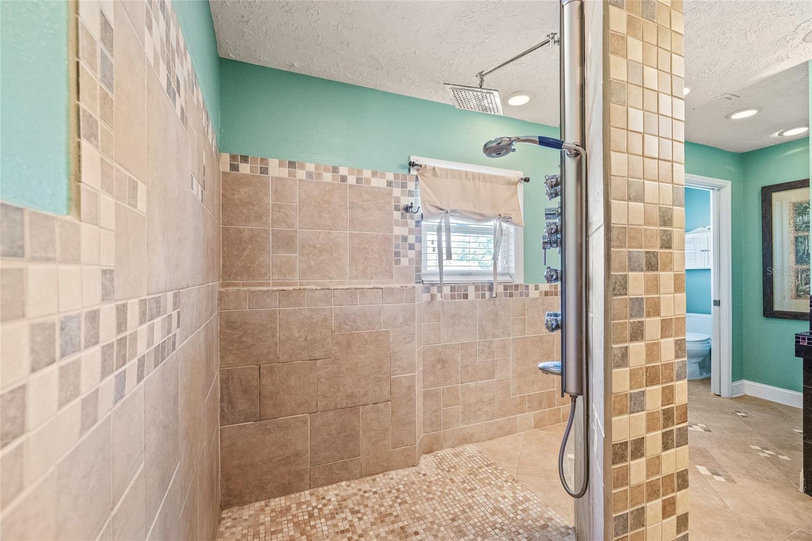 Custom shower with travertine