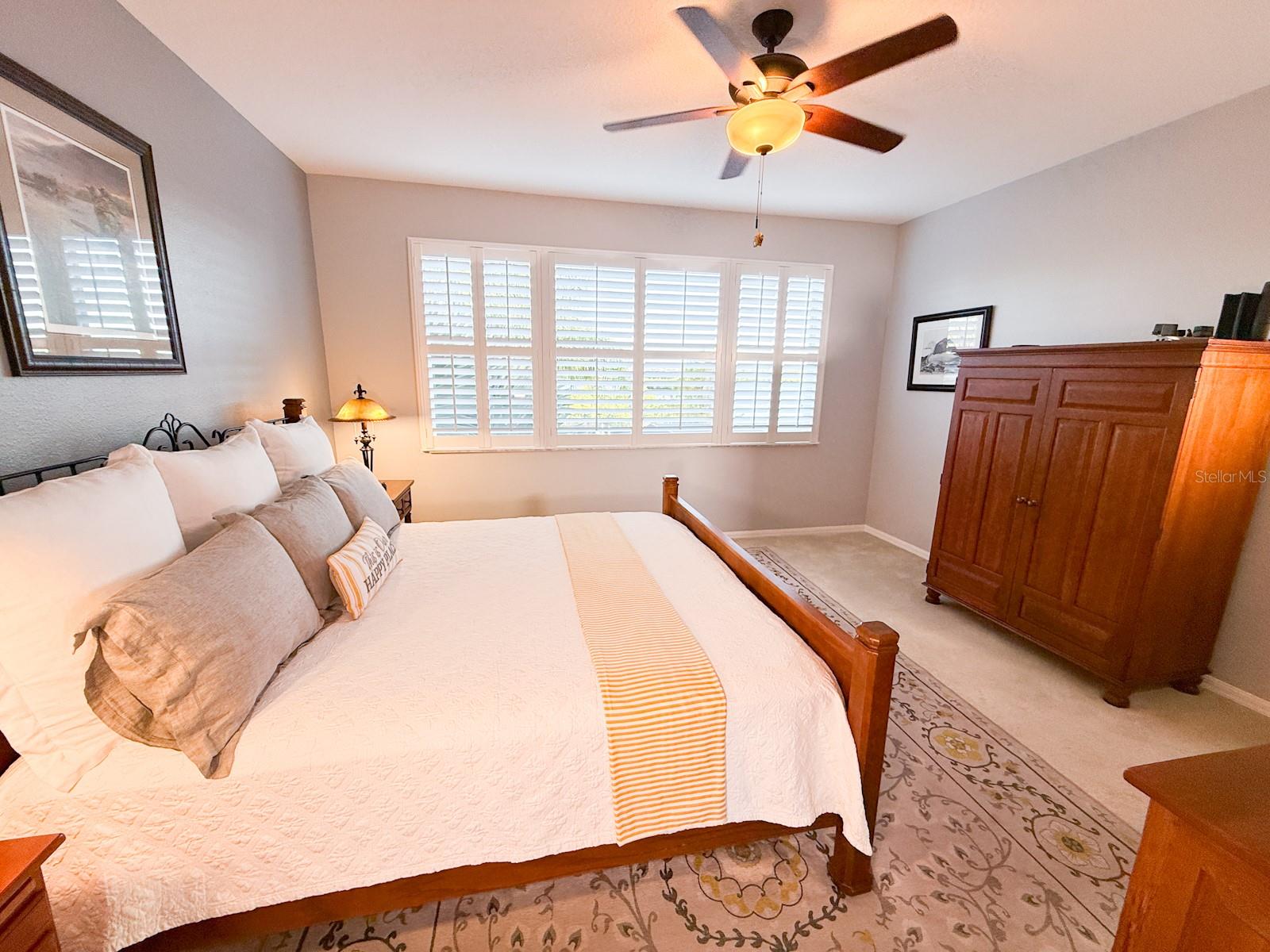 primary bedroom overlooking Anclote delta and pool