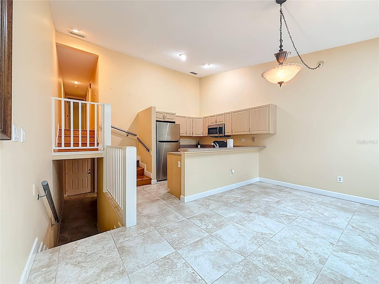Dining room and steps going up to 3rd floor