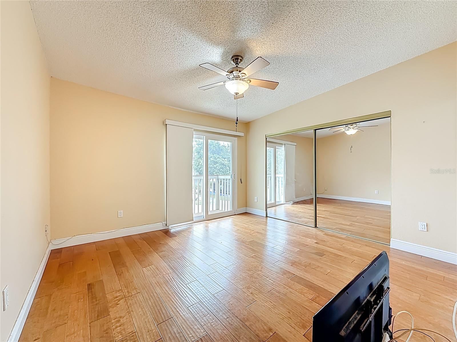 Primary bedroom with balcony
