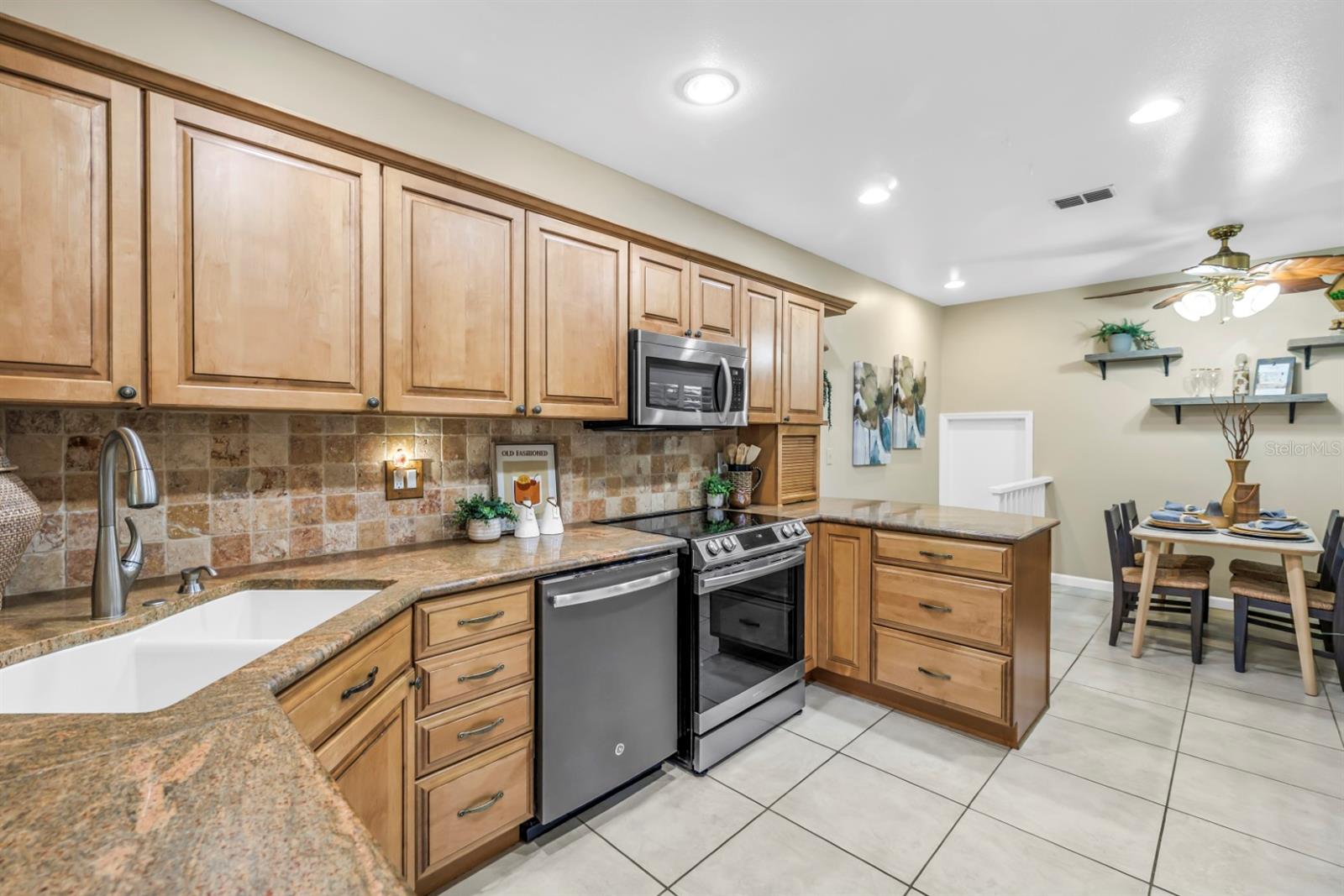Kitchen with Stone Counters and Stainless Appliances