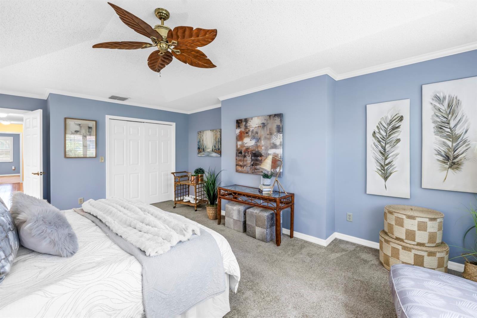 Primary Bedroom with Dual Closets and Crown Moulding