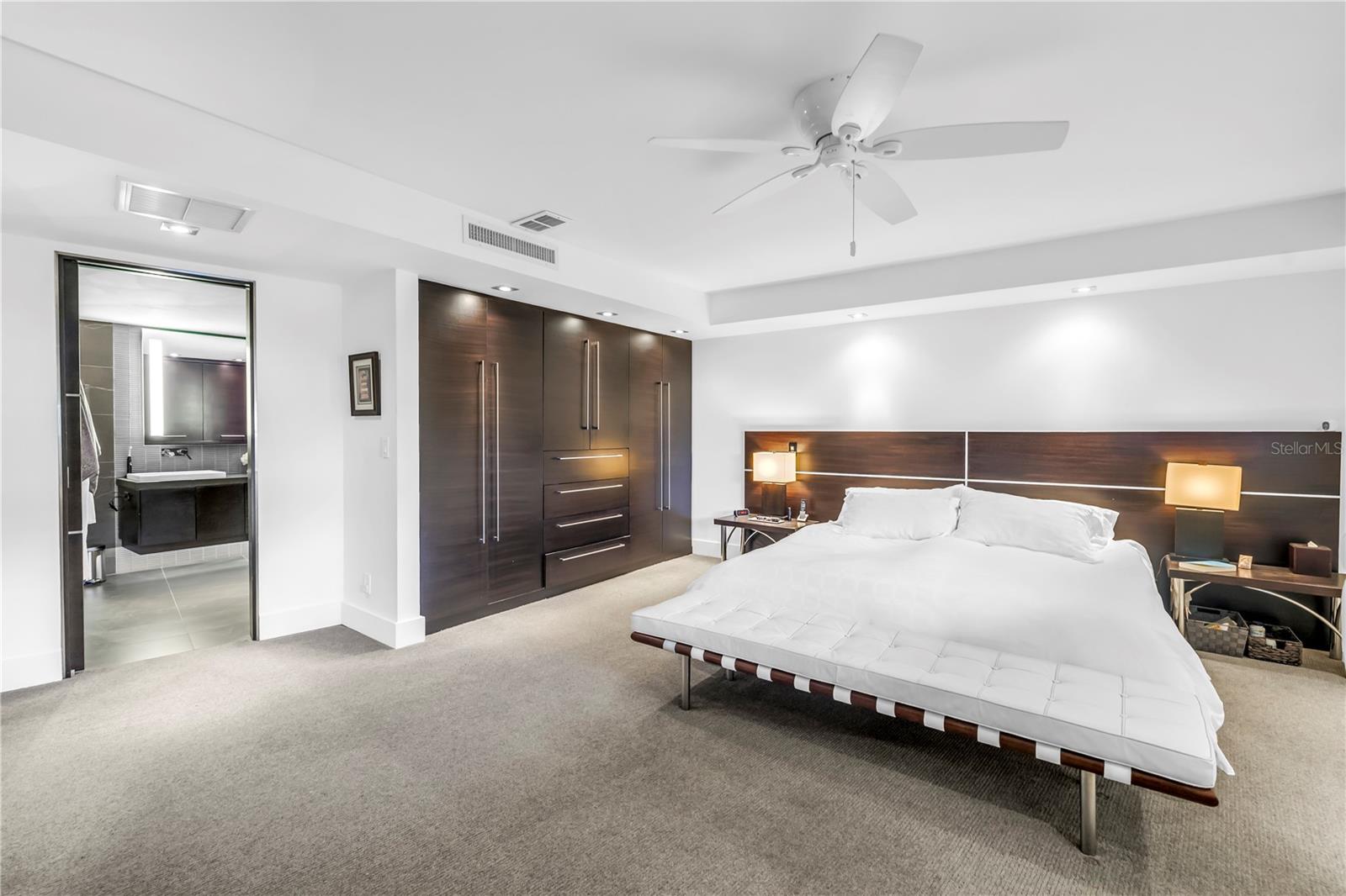master bedroom with open door to master bath