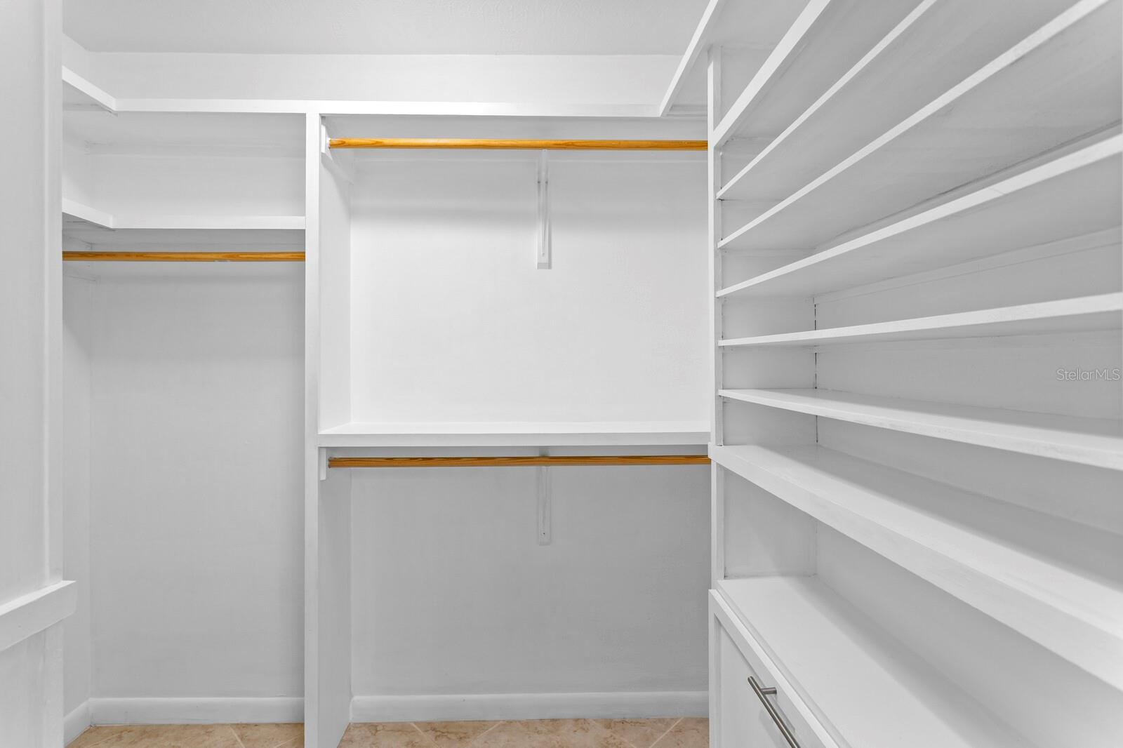 Custom closet organizer in primary suite