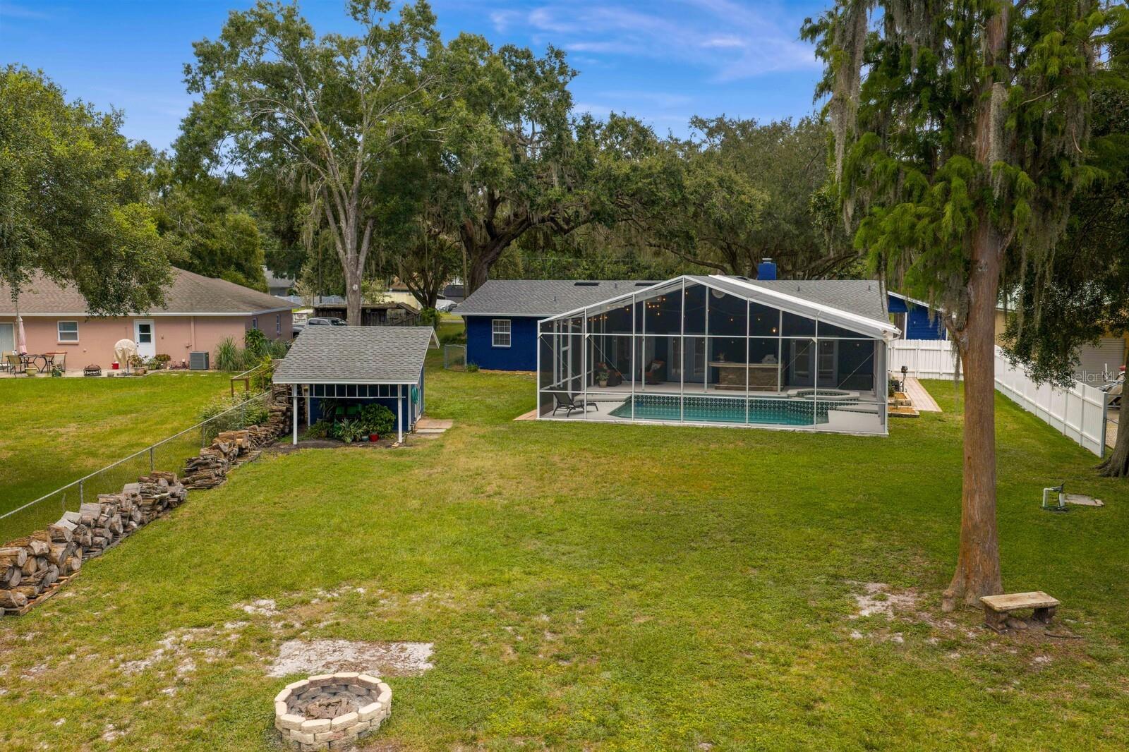 Views of back of the home and storage shed
