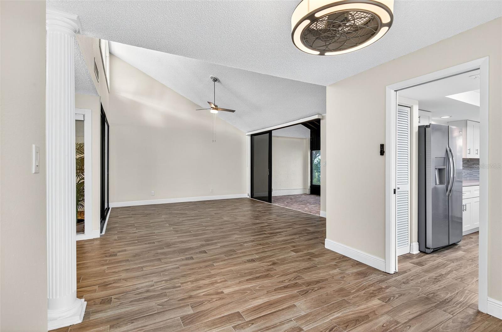 Dining Room Opens to Living Room and Kitchen to the Right