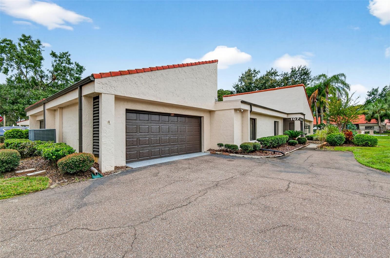 Front view of home, 2 car garage & parking pad