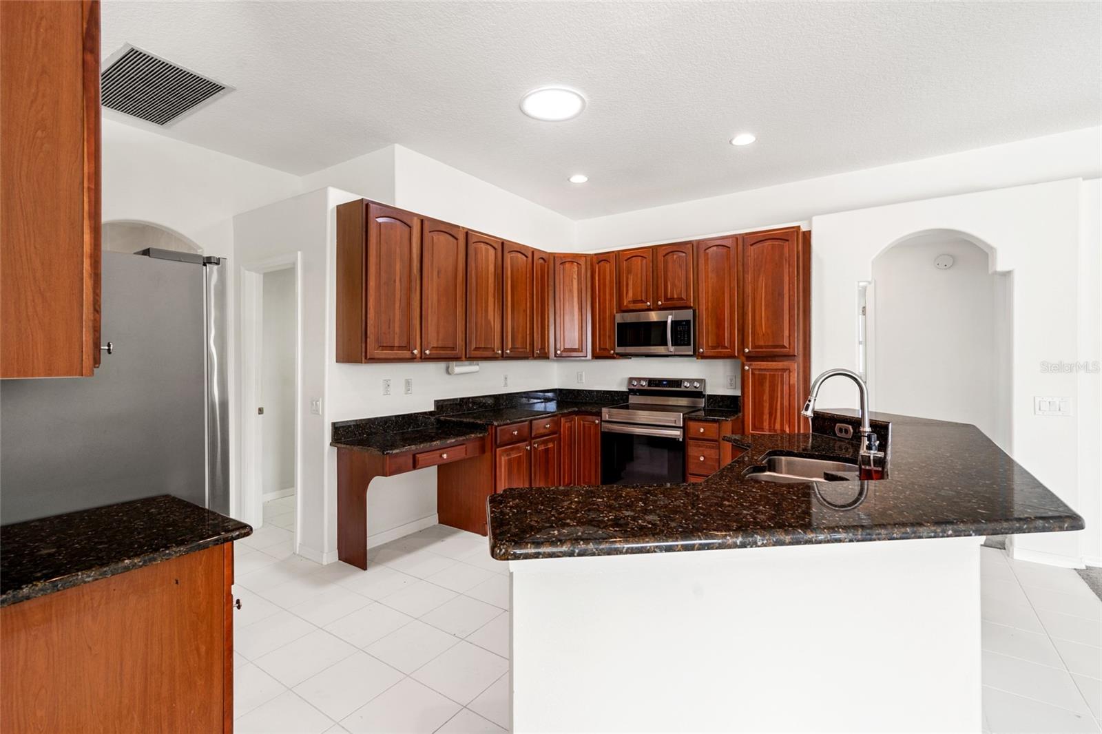 Breakfast Bar and Built In Desk in Kitchen