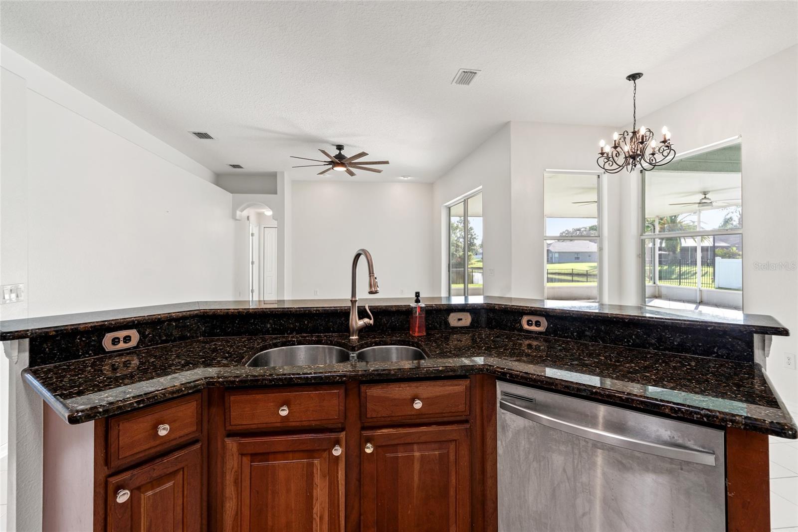 Kitchen Island with view of Dinette area and Family Room
