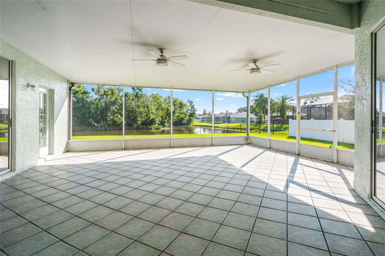 Grand Covered and Screed Lanai With Full Pond View
